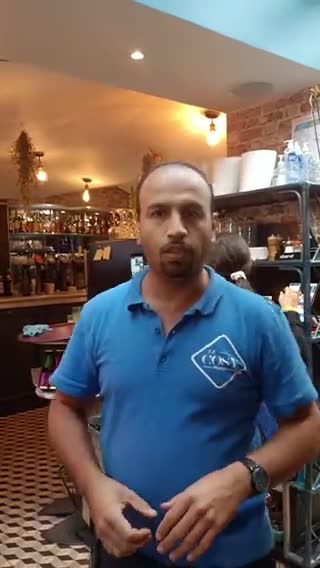 The manager of a restaurant in Paris escorted two Ukrainian women while glorifying Putin