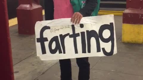 Man pink pig outfit with farting sign