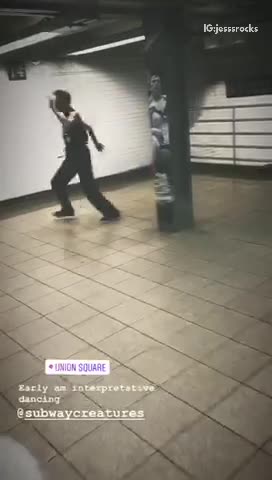 Sleeveless black shirt guy does ballet in subway