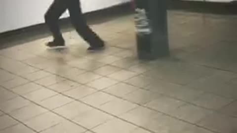 Sleeveless black shirt guy does ballet in subway