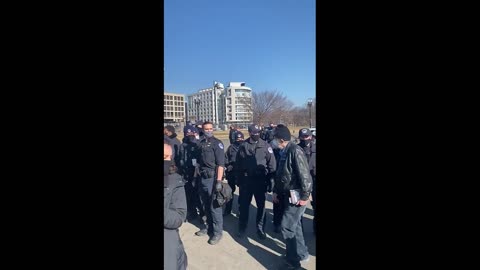 Protesters Arrive Outside Capitol Holding "Expel All Fascists" Sign