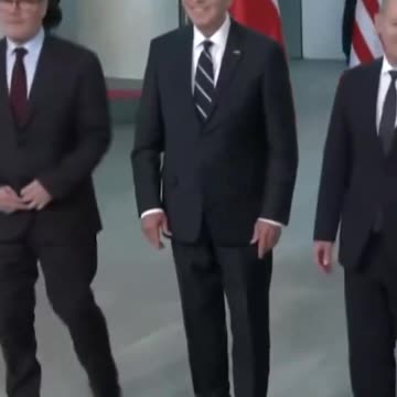 Biden gets confused taking a photo