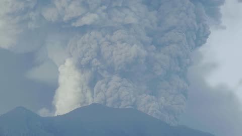 An Erupting Volcano Spewing Volcanic Ash Up In The Air