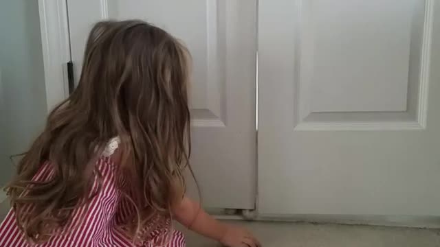 3-year-old plays adorably fun game with her kitten