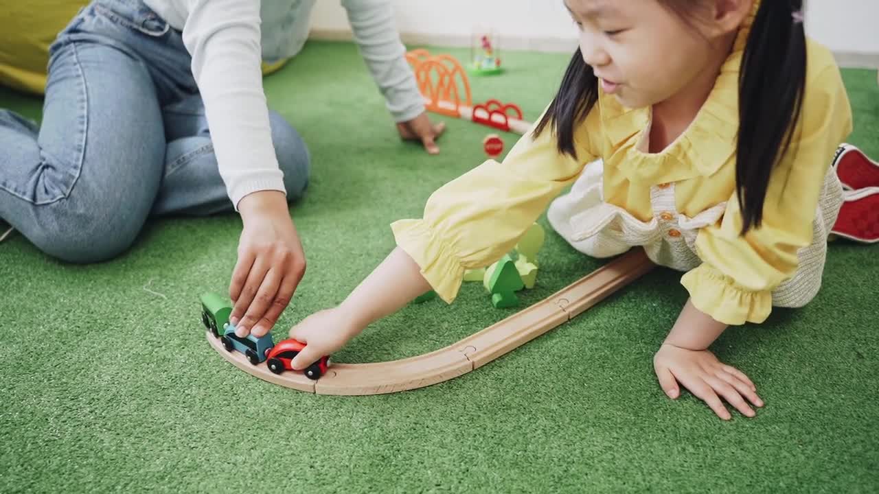 Little girl play his father with Cars