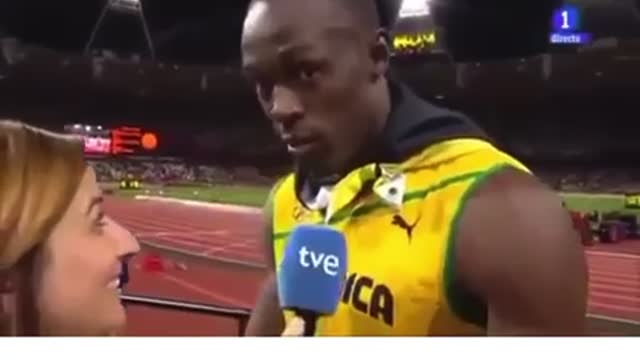 Usain Bolt stops interview to honor America’s national anthem.