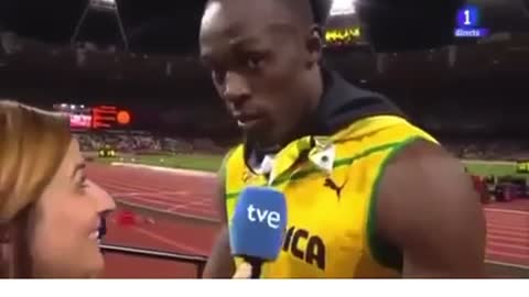 Usain Bolt stops interview to honor America’s national anthem.