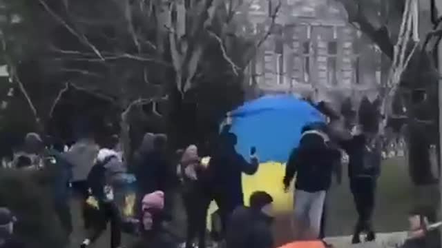 Ukrainians out in the streets while there's gun fire, this is what true patriotism looks like