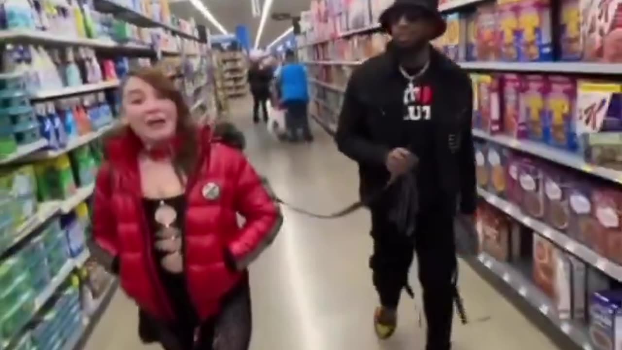 Joseph Martelli Black guy walks white girl on a leash