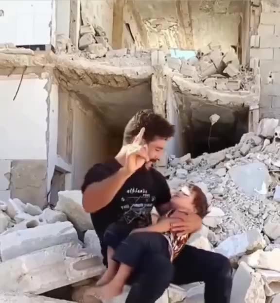 A Palestinian father cries for his dead son whose leg suddenly itches.