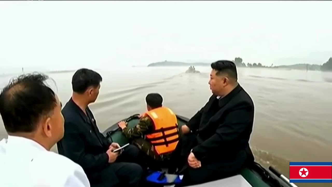 North Korean leader Kim inspects flooded area on rubber boat _ AFP