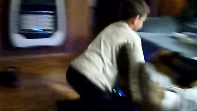 Grandson safely riding hoverboard