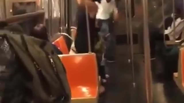 Asian Woman Rips Down ads on NYC Subway Train