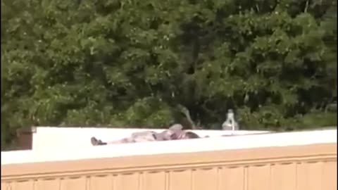 the gunman lying motionless on the roof during the failed assassination attempt on Mr. Trump