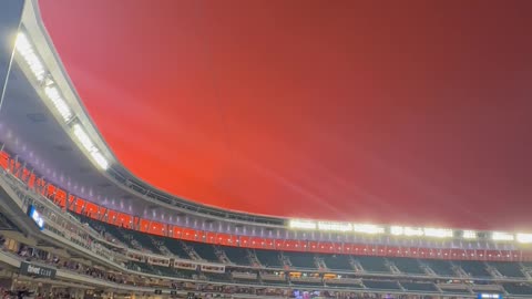 Red Sky with Double Rainbow over Baseball Stadium