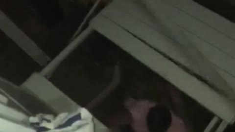 Guy falls through roof pink shirt