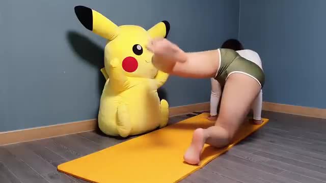 Pikachu watching the hot girl doing yoga