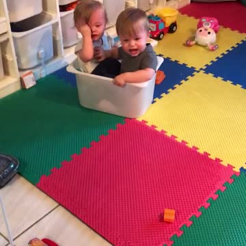 Toddlers Get Stuck In Plastic Bin Together