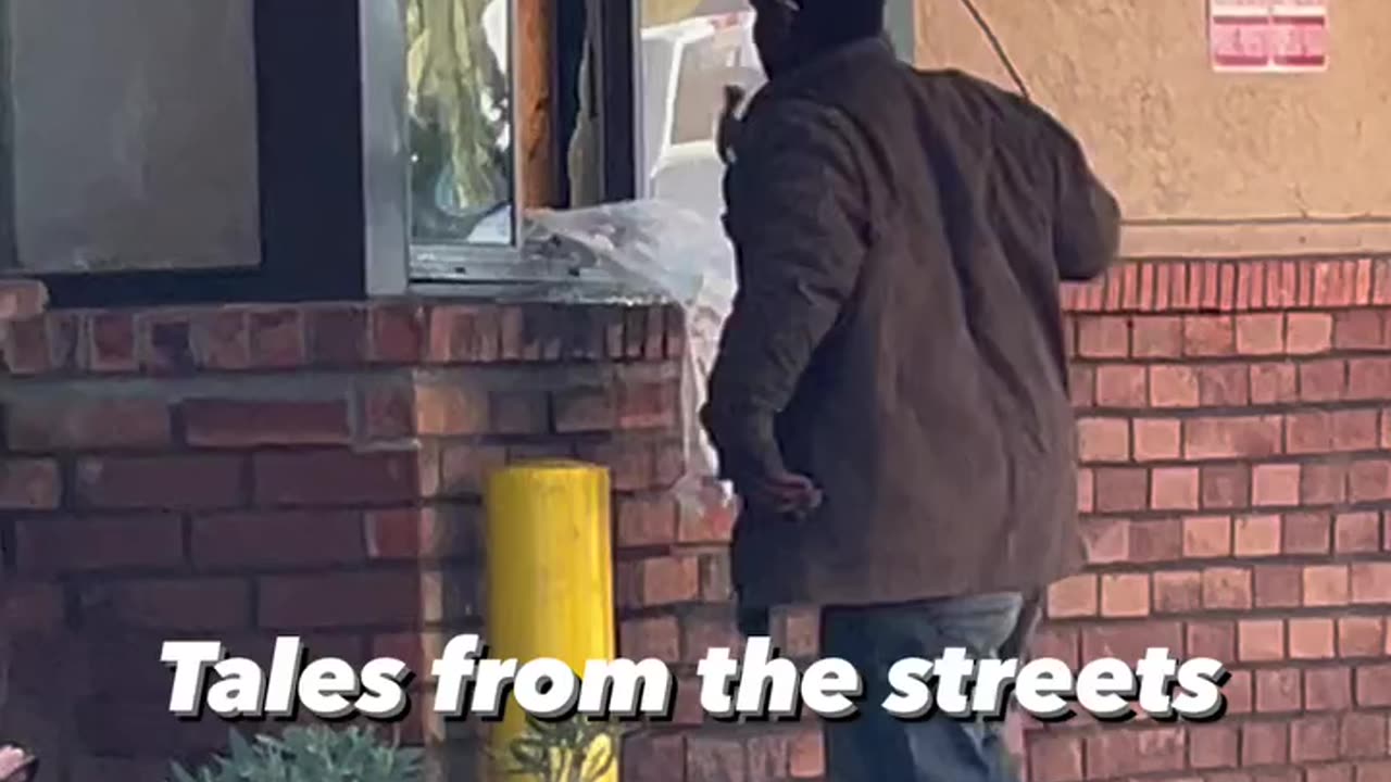 A Drug addict person trying to break the window caught on camera