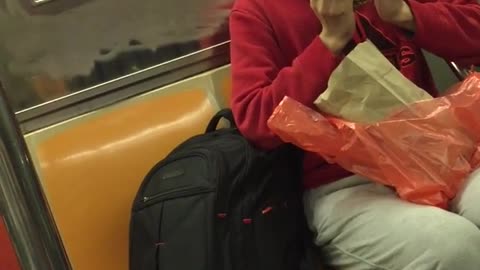 Red shirt man falls in love with crab on subway