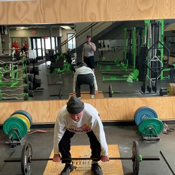 Old man cleaning 135 for three reps