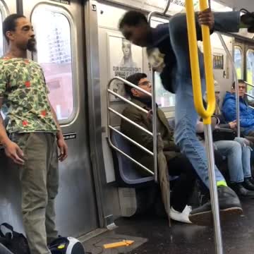 Guy blue sweater jeans dancing on pole