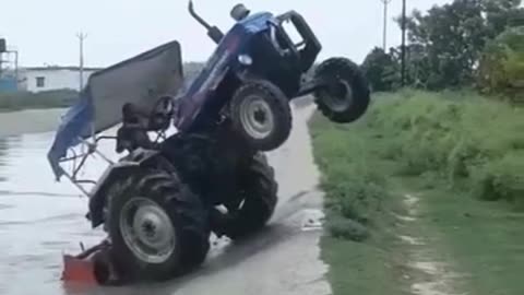 Tractor crossing the river against flow