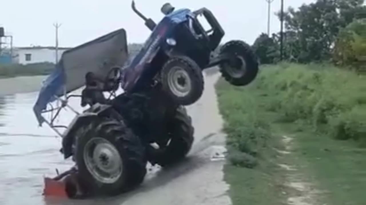 Tractor crossing the river against flow