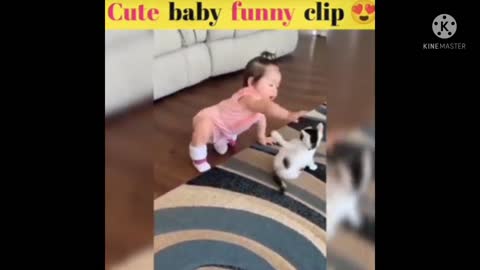 Sweet cute baby playing with a cat