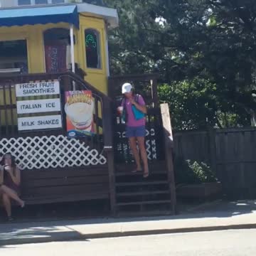 Girl in pink wearing blue life vest