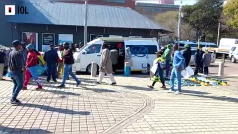 Carl Niehause and ANC members march to Luthuli House