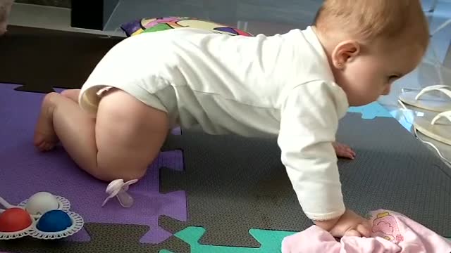 Baby trying to crawl for the first time