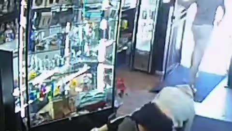 Store Owner Surprises Armed Robber