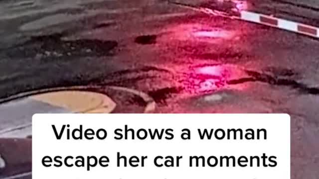 Woman's car gets stuck on rails, nearly hit