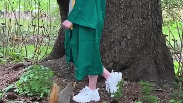 Squirrel enjoying the graduation degree happiness with girl