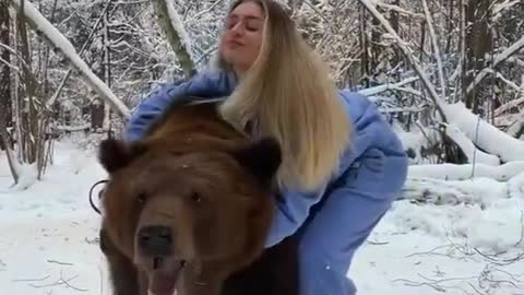 this woman has a pet bear