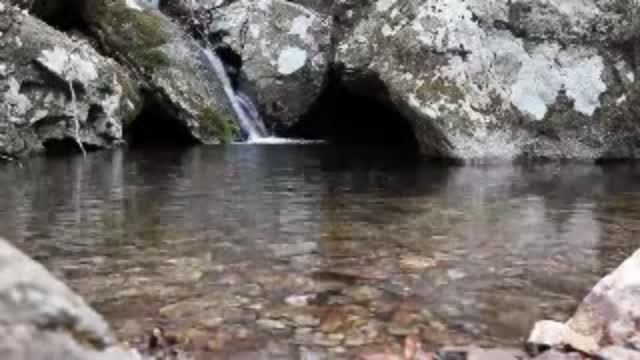 Waterfall with rocks and caves