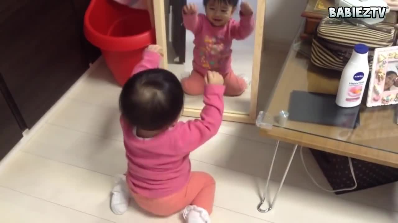 Funny Baby Sees Mirror