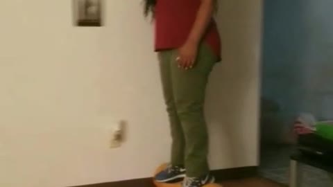 Girl yellow hover board knocks down frame