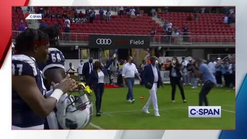 Kamala Harris has to pip in crowd noise for a coin toss.