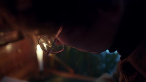 Close Up View of a Man Writing on a Notebook