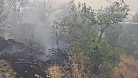 Albanian authorities continue to battle wildfires.mp4