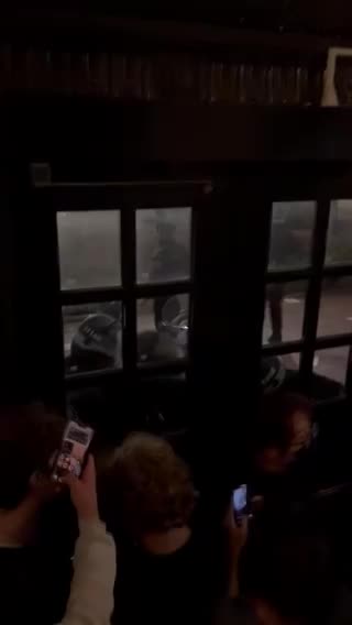 Police barricades observers, medics, journalists, and students into John Jay Hall.