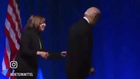 Kamala saves Biden from falling of stage !