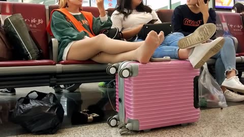 Chinese gals at the train station...