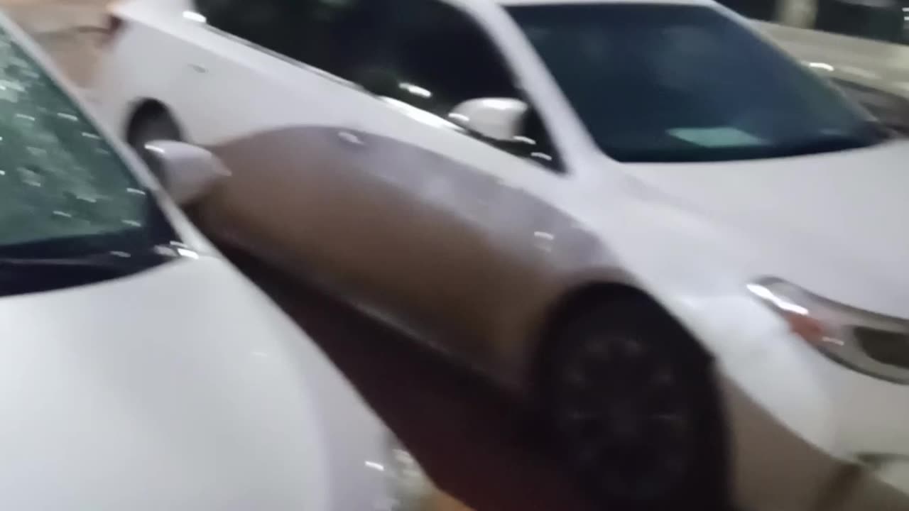 it's raining what is this guy doing