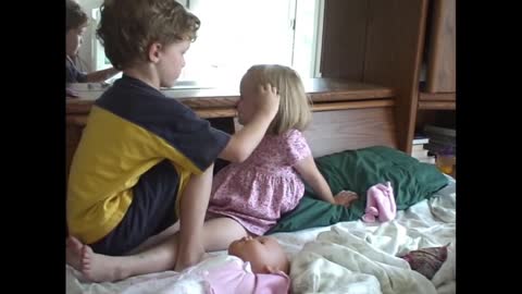 Matthew putting makeup on Katie