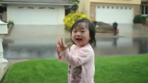 Little Girl Experience her first rainfall