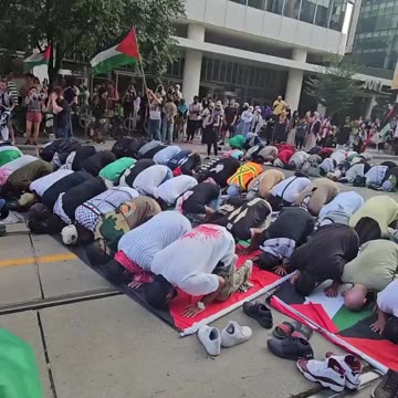 Muslims block the tram rail to pray while hundreds of Canadian passengers wait for them.