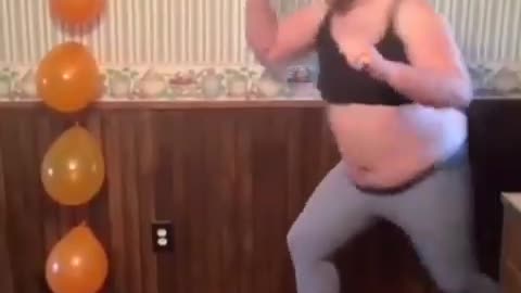 girl hitting the balloon on the wall with perfect kick.